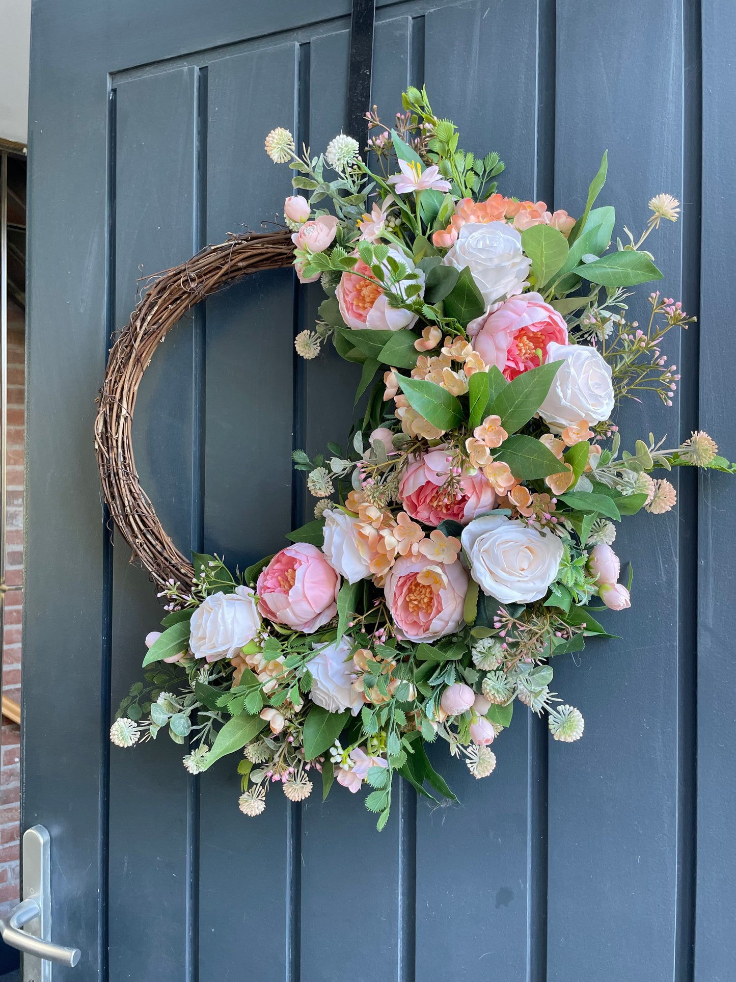Coral peony half wreath