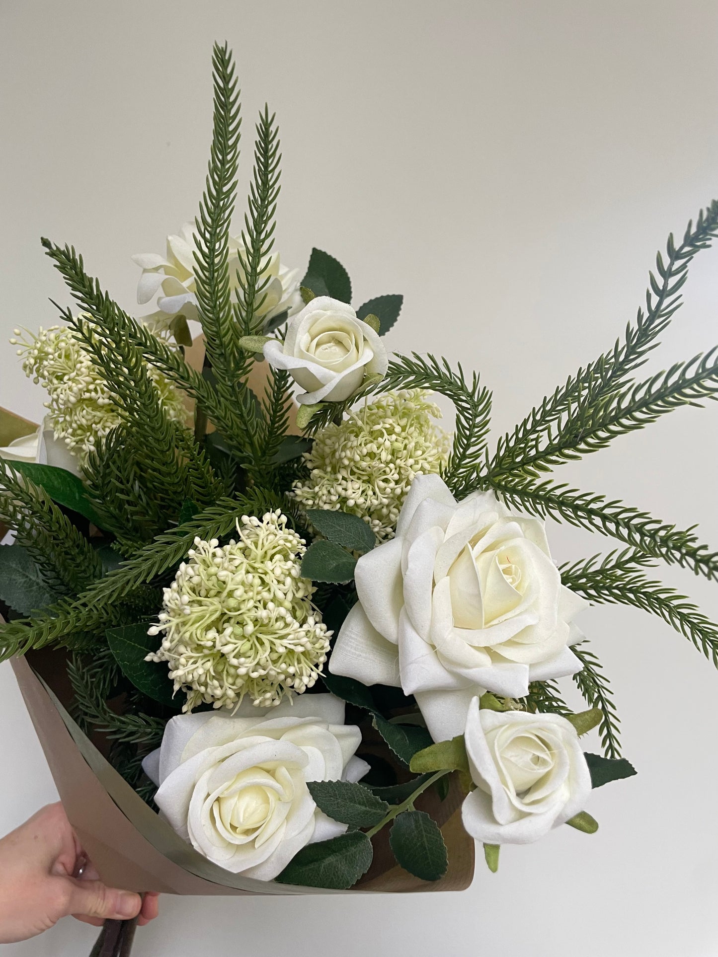 Faux Ivory skimmia & rose arrangement