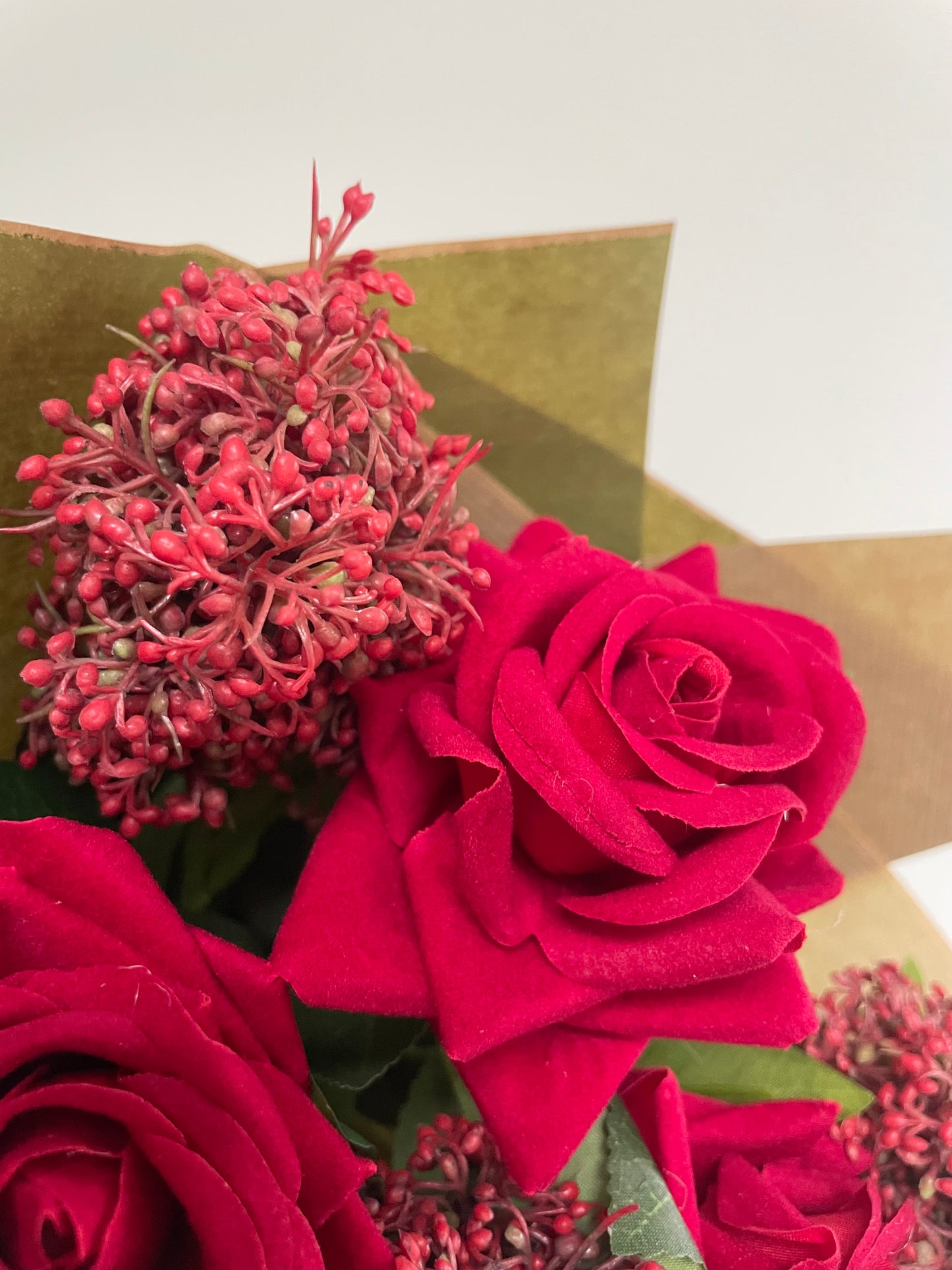 Faux red rose & skimmia posy