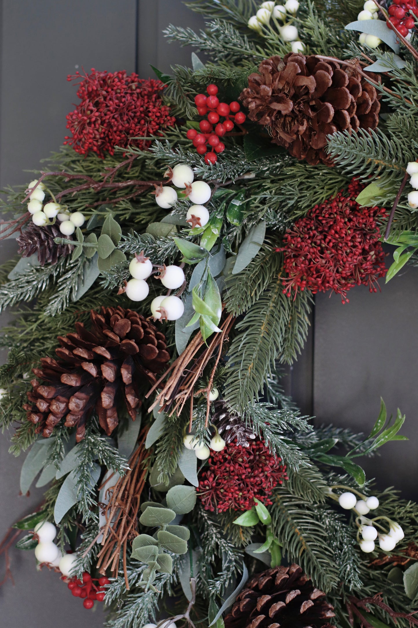 Faux skimmia and pinecone wreath