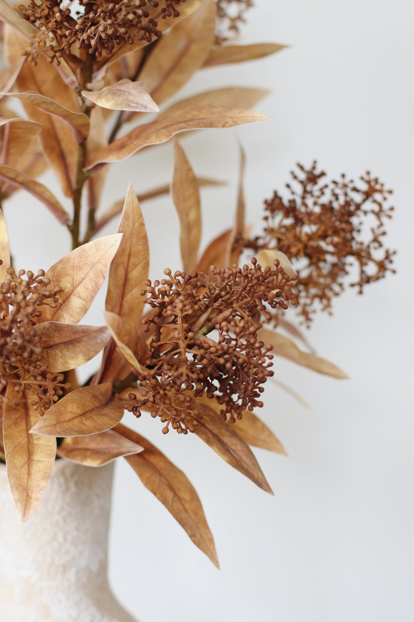 Faux skimmia arrangement