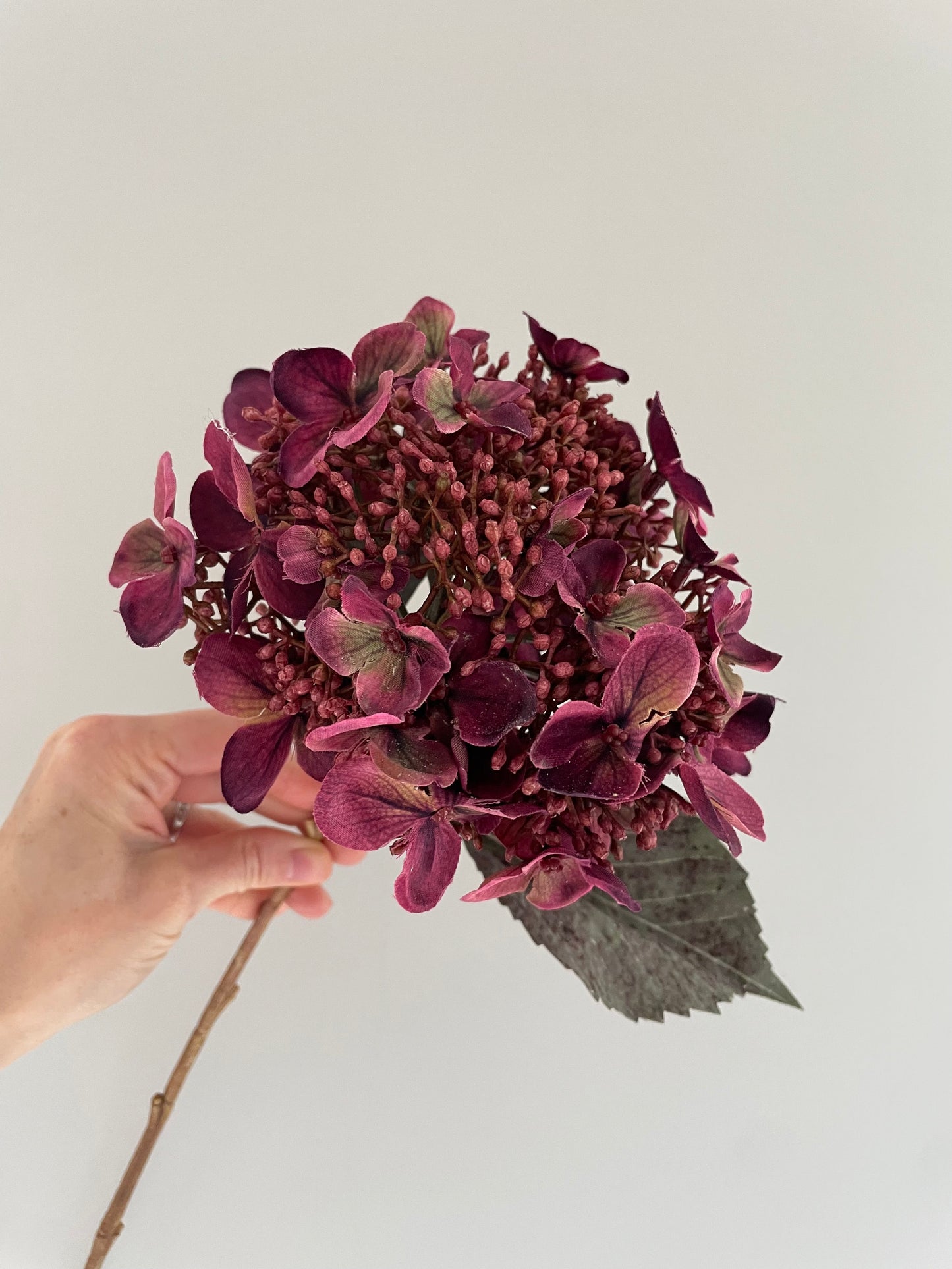 Faux burgundy hydrangea stem