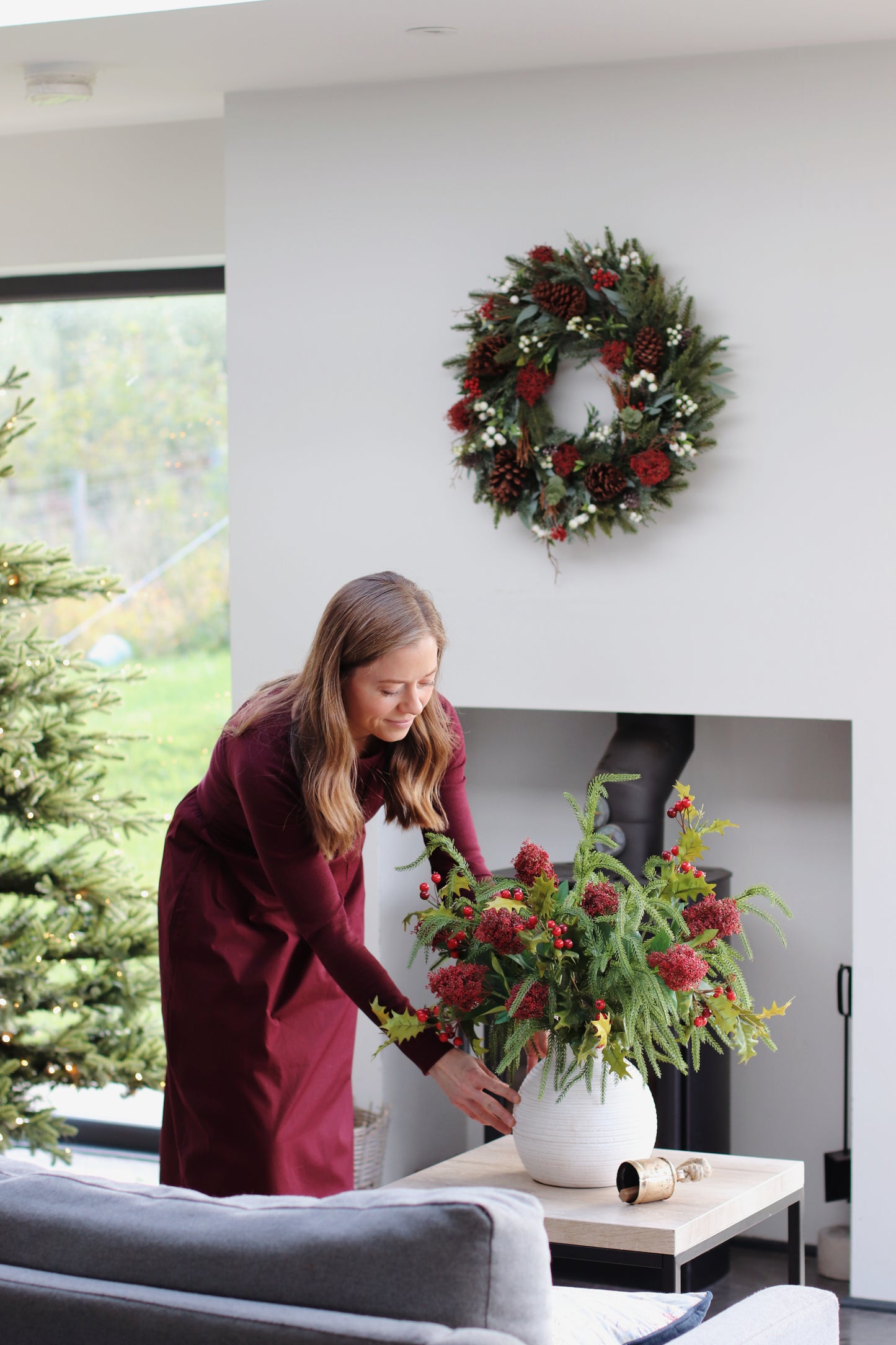 Faux skimmia and holly arrangement