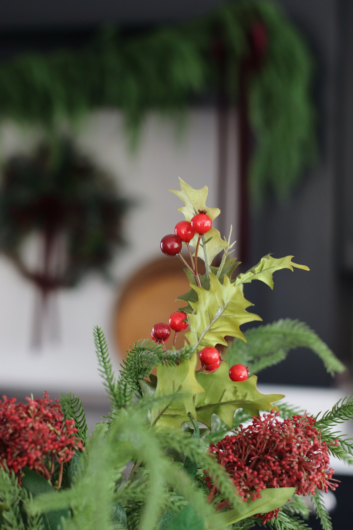 Faux skimmia and holly arrangement