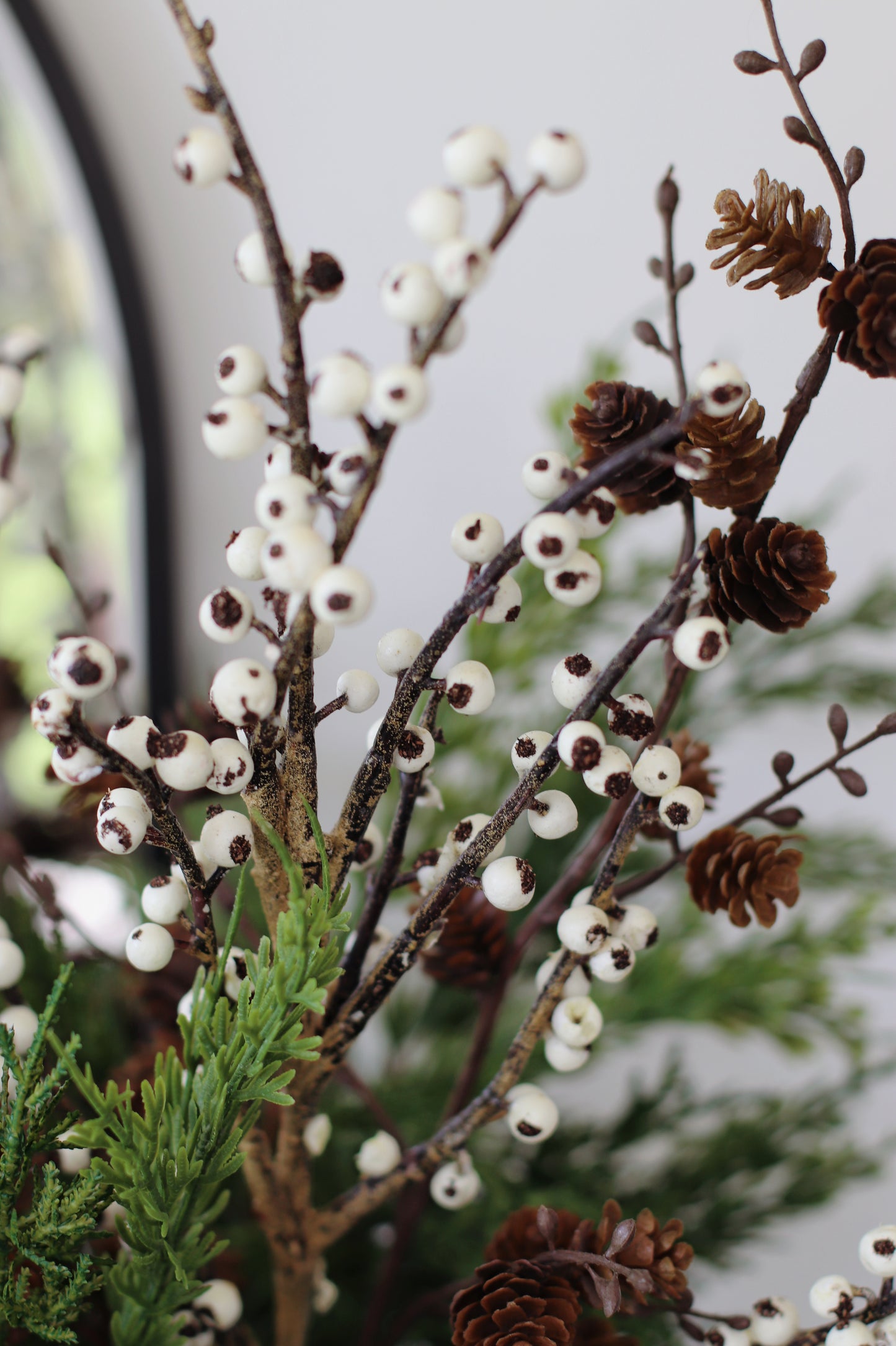 Faux ivory berry & cedar arrangement