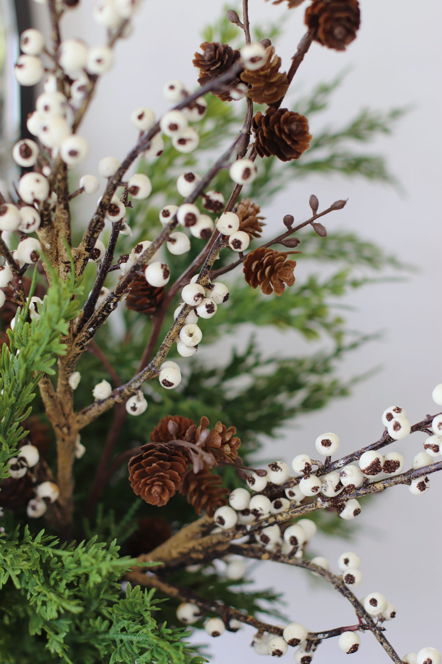 Faux ivory berry & cedar arrangement