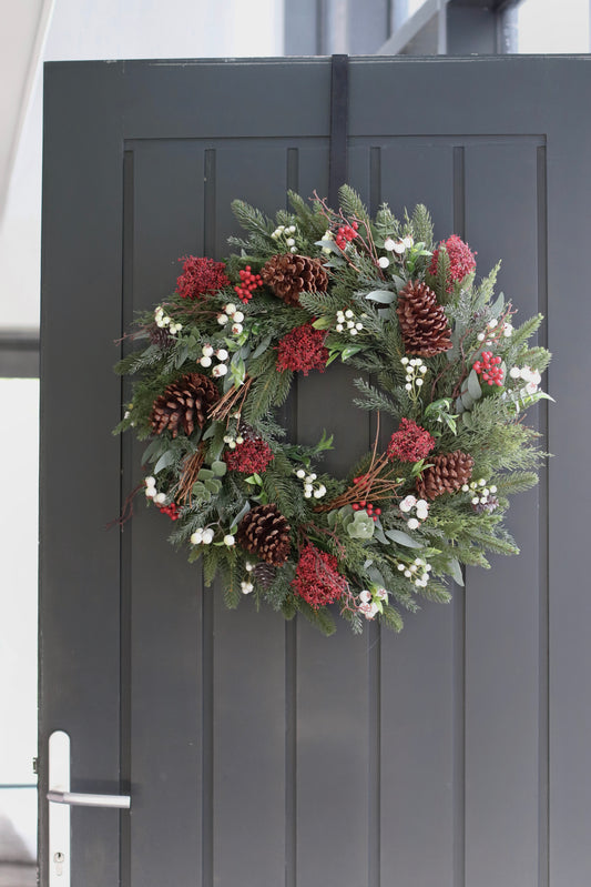 Faux skimmia and pinecone wreath
