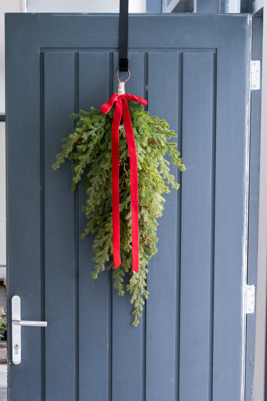Faux fir swag with red bow