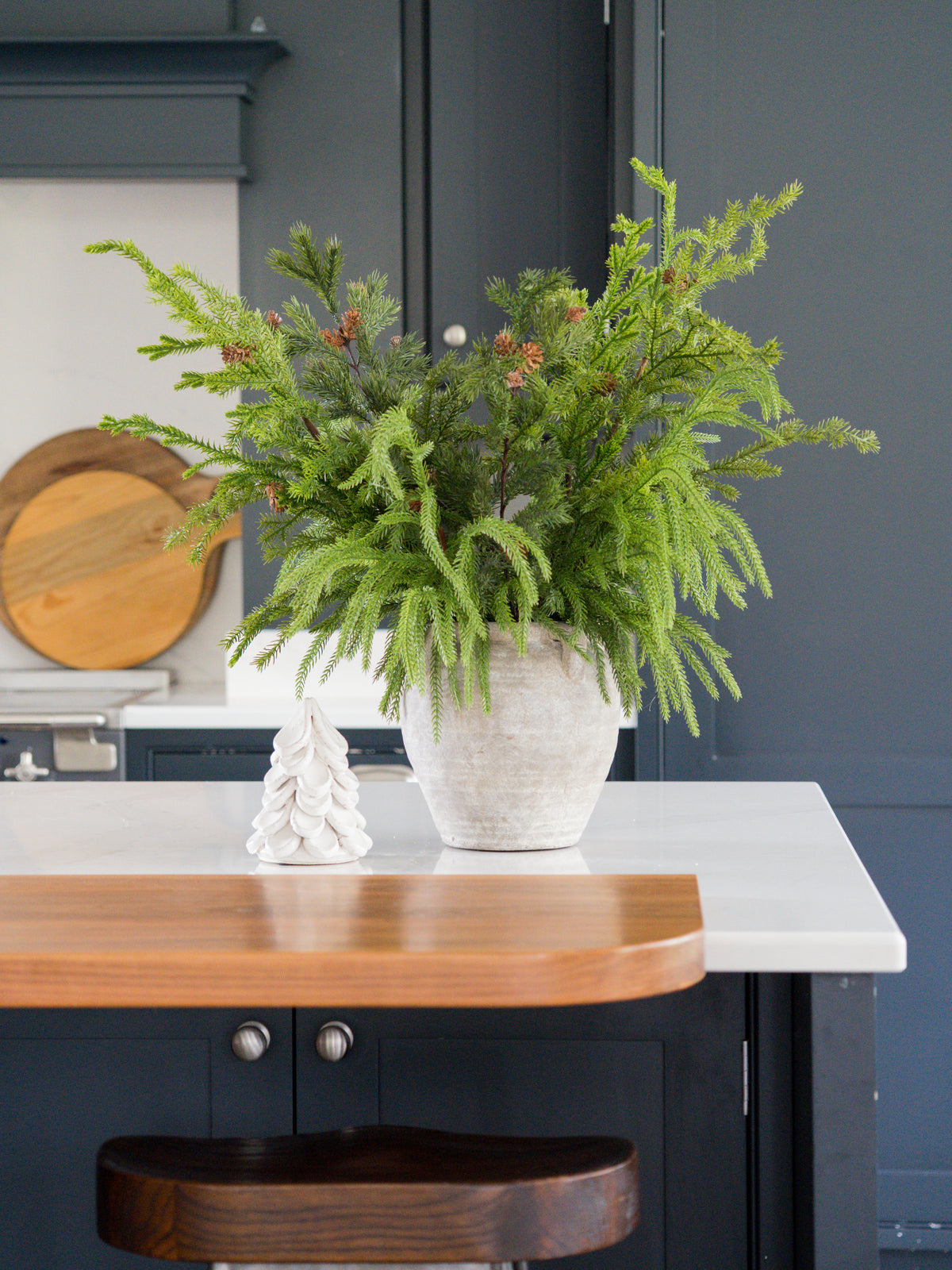 Faux winter foliage arrangement