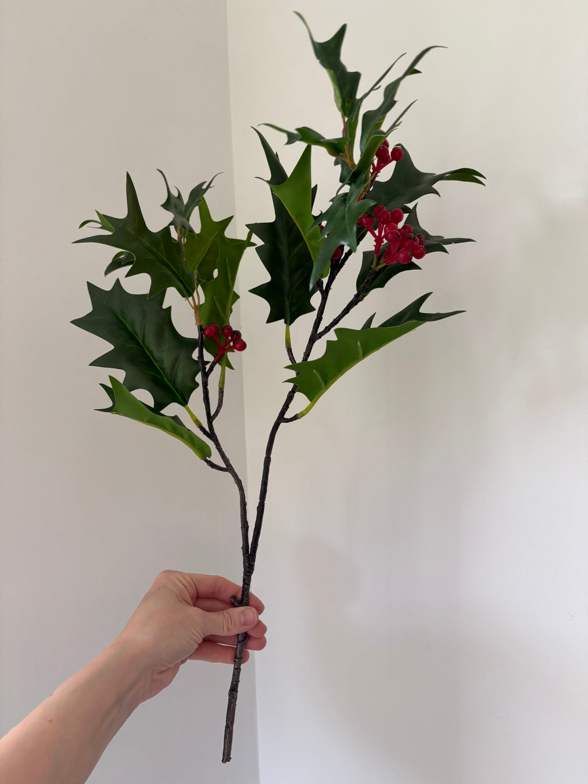 Faux green holly berry stem