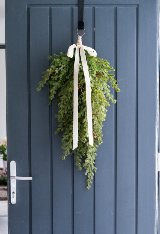 Faux fir swag with ivory bow