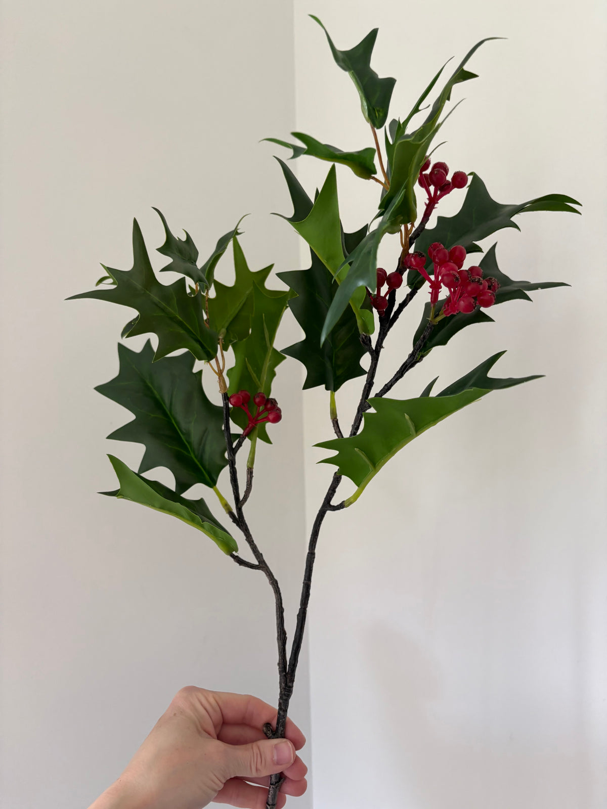 Faux green holly berry stem