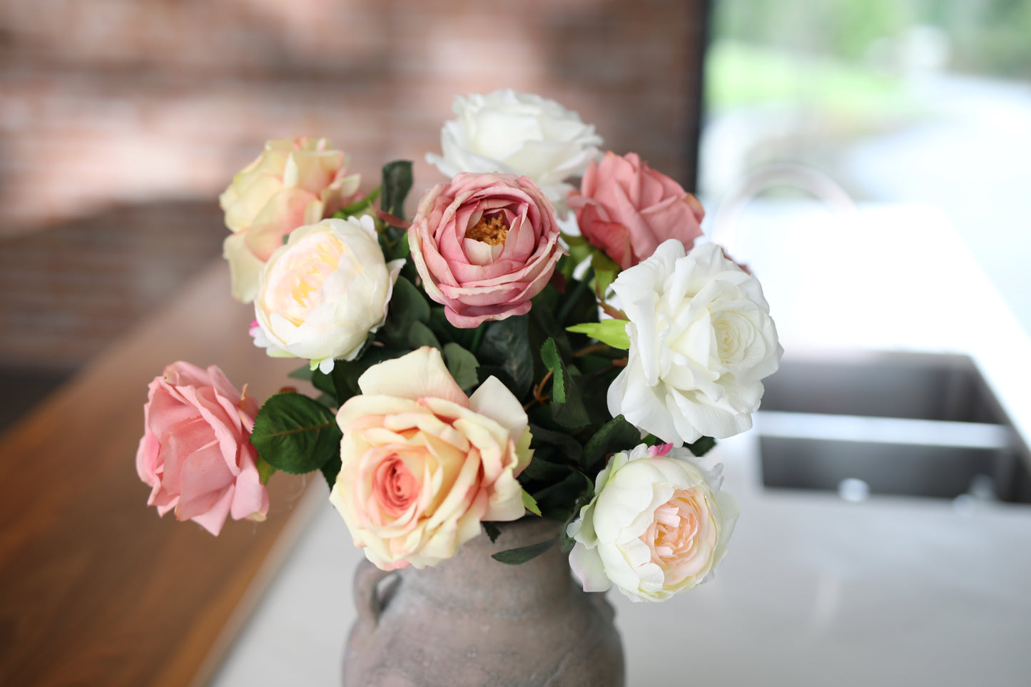Faux peony and rose arrangement
