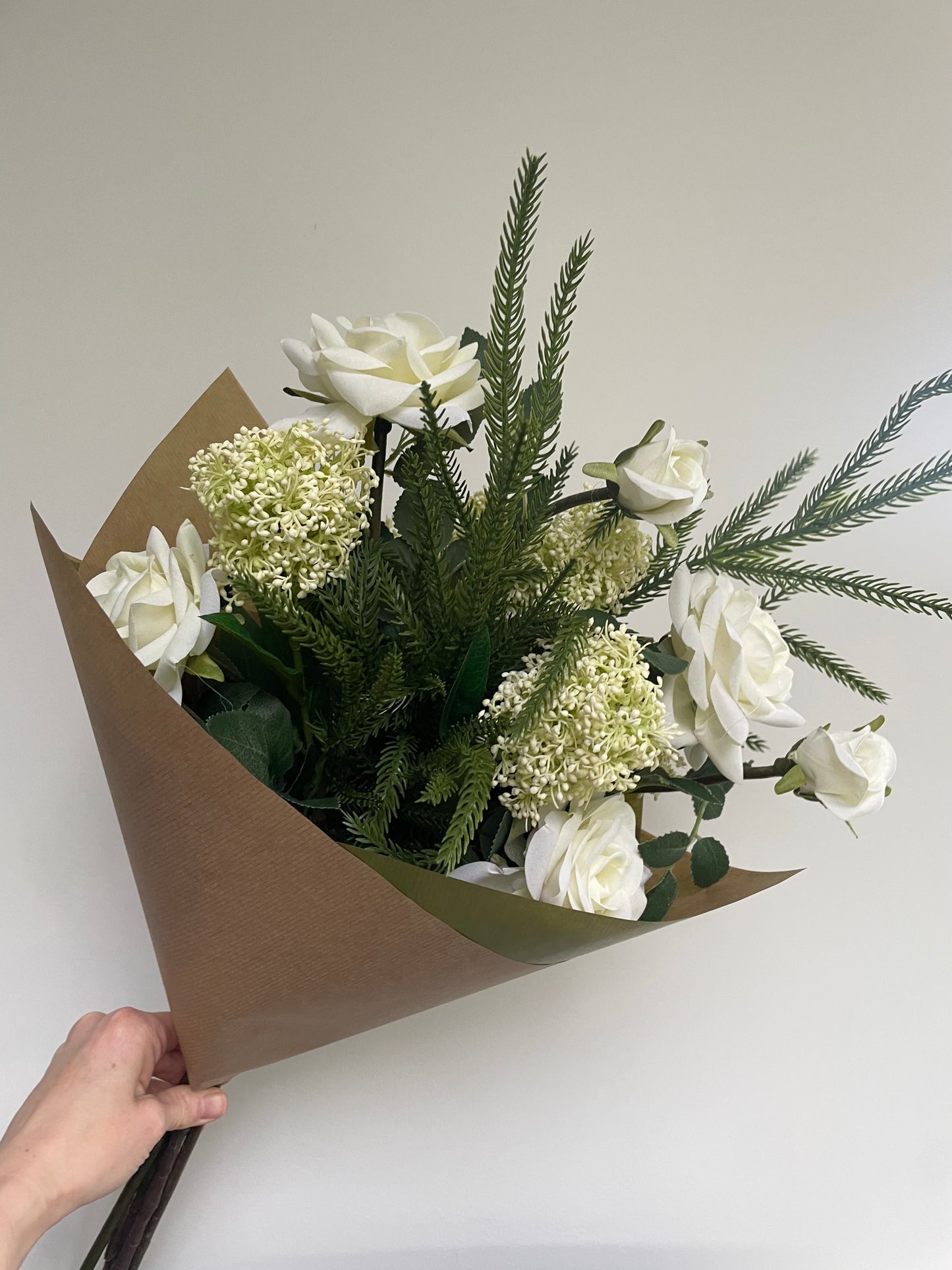 Faux Ivory skimmia & rose arrangement