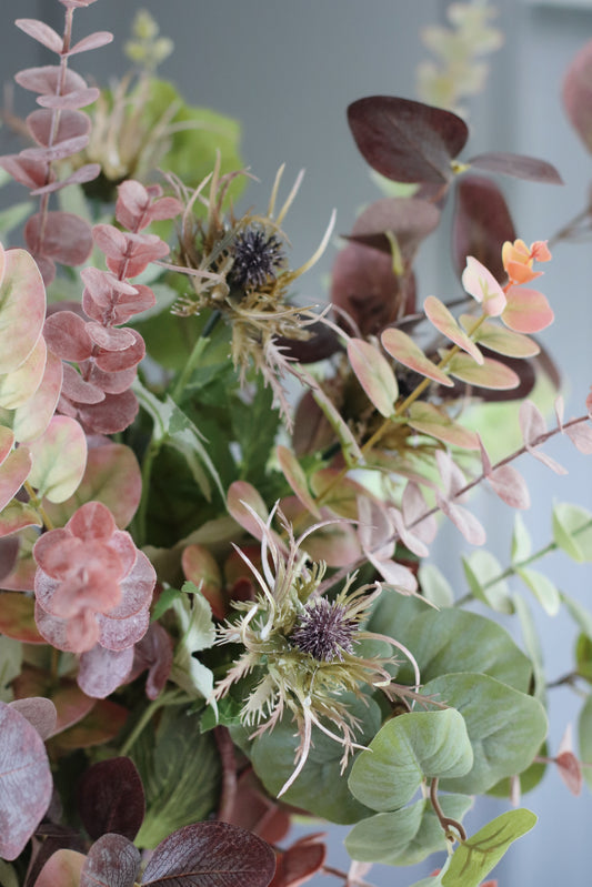 Faux autumn foliage arrangement