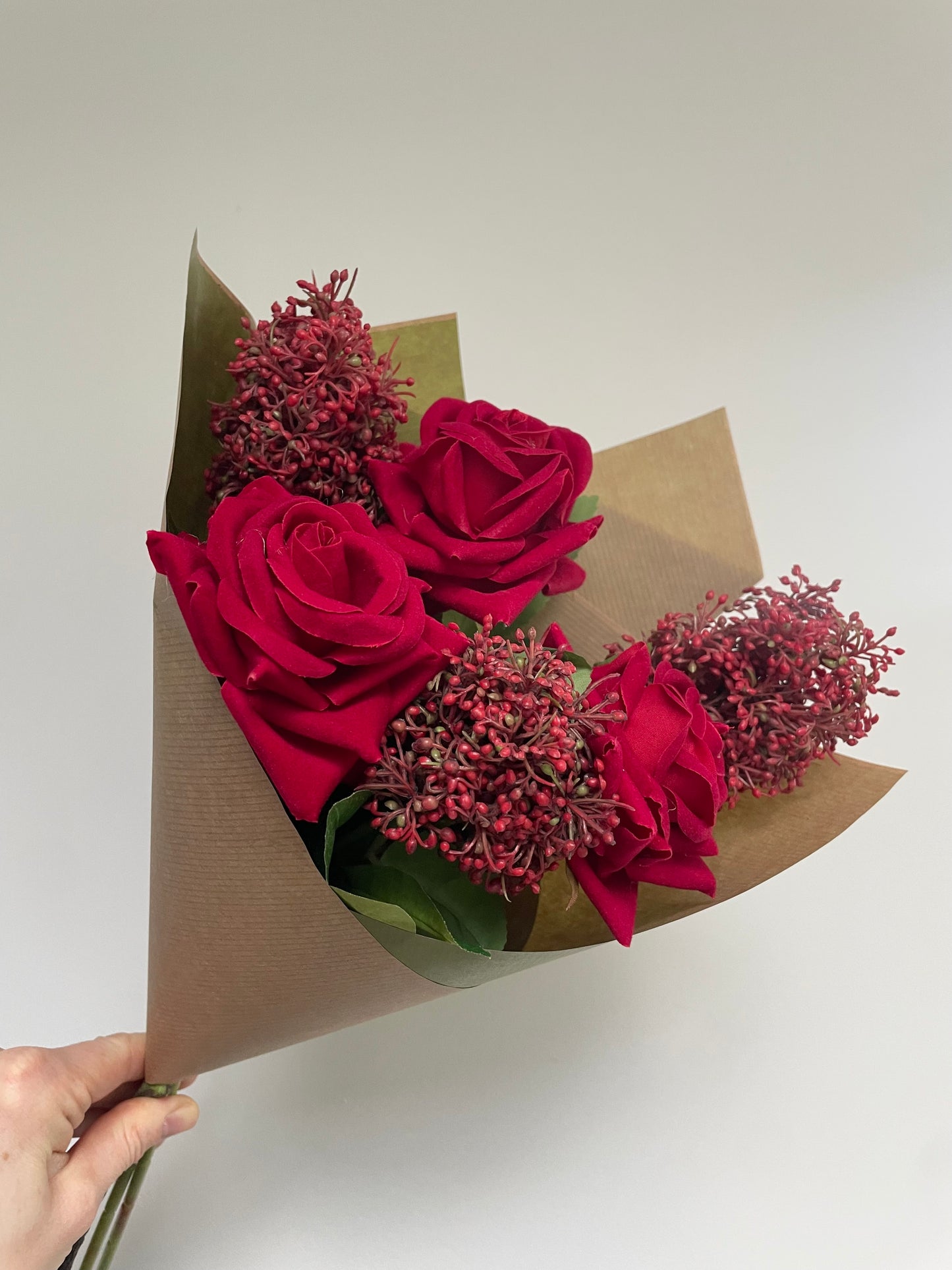 Faux red rose & skimmia posy
