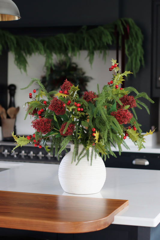 Faux skimmia and holly arrangement